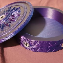 Decorative purple container on a brown surface