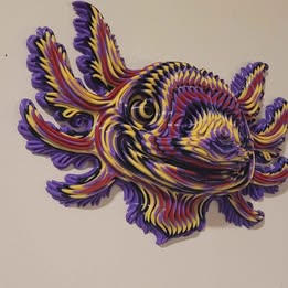 Colorful abstract axolotl sculpture on a beige background