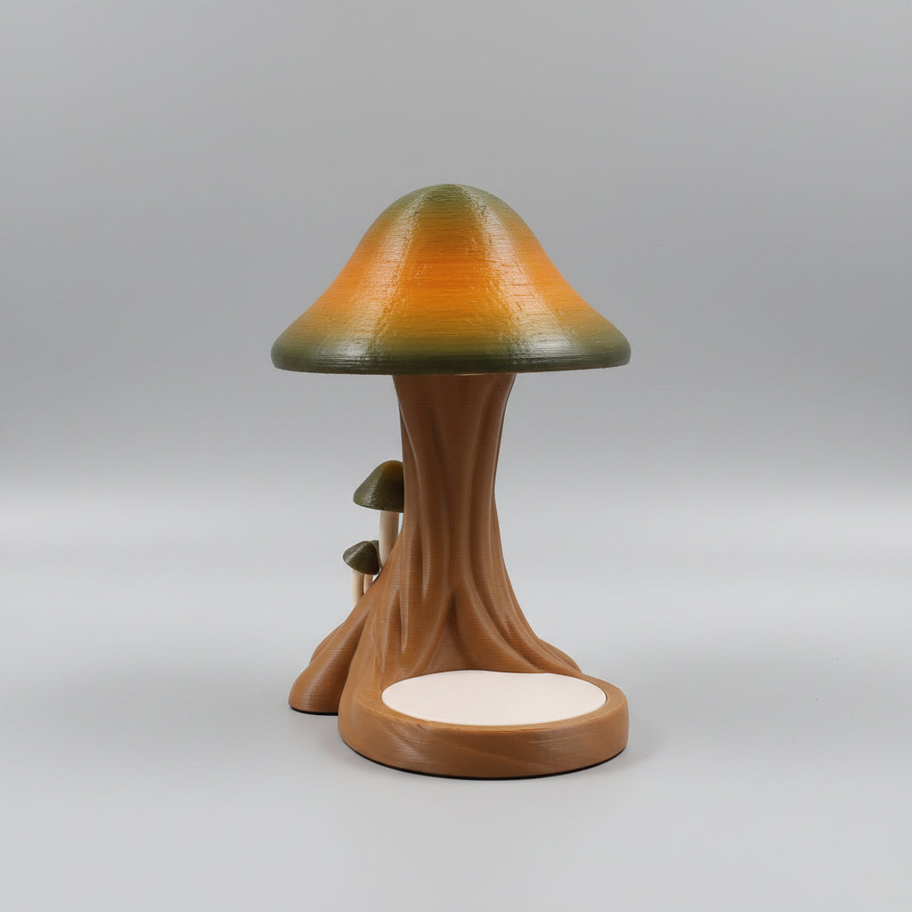 Decorative lamp with a tree-like base and colorful shade on a dark background
