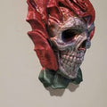Decorative skull in rose head with red and gray colors on a plain background