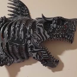 Black and white shark sculpture on a beige background